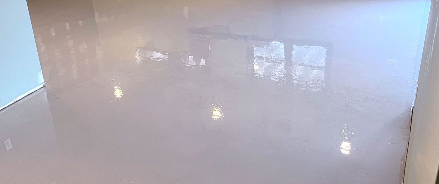 High-gloss, mirror-like reflective grey polyaspartic and urethane floor